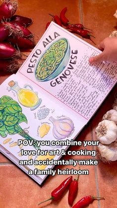 a recipe book sitting on top of a kitchen counter next to garlic and red peppers