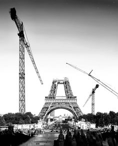 black and white photograph of the eiffel tower under construction