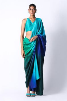 Emerald green and blue silk pre draped saree in an ombre base. Comes with tasselled back blouse. Components: 2 Pattern: Ombre,Embellished Type Of Work: Sequin Neckline: V-neck Sleeve Type: Sleeveless Fabric: Silk Color: Emerald Green,Blue Other Details:  Built in petticoat Closure: Saree: Front button Occasion: Cocktail,Reception - Aza Fashions Blue Green Saree, Pre Draped Saree, Dress Code Guide, Green Silk Saree, Combination Dresses, Draped Saree, Sarees For Girls, Colour Combinations Fashion