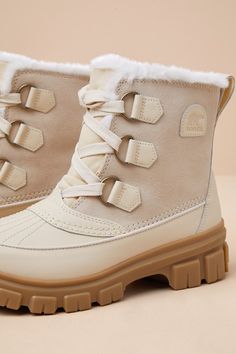 Trekking through the elements will be oh-so easy (and stylish) thanks to the Sorel Tivoliâ„¢ V Honey White and Sea Salt Waterproof Ankle Boots! These winterproof boots have a genuine suede leather construction, along with PU coated leather that shapes the rounded toe upper, mudguard, and heel overlay. The ankle-high shaft features a classic lace-up vamp with a canvas tongue, a faux fur collar with a OutDry microfleece lining, and a convenient pull tab at back. A bold lug sole completes the ready for anything design. Laces are not waterproof. Logo at the outstep and heel. 1" rubber heel. Lightly cushioned insole. Rubber sole has nonskid markings. Genuine Suede Leather Upper And OutDry Waterproof Construction. Balance Man Made Materials. Imported. Lulus | Tivoliâ„¢ V Honey White and Sea Salt Ankle High Heel Boots, White Winter Boots, Neutral Boots, Neutral Flats, Sorel Tivoli, Ivory Shoes, Chic Boots, Lulu Fashion, Winter Chic