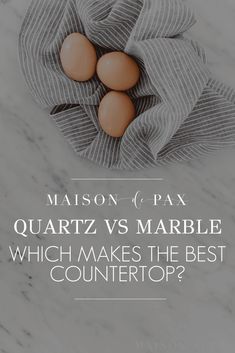 three eggs in a towel on top of a counter with text that reads, mason & pax quartz vs marble which makes the best countertop?