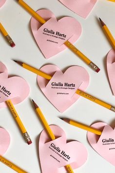 pencils and paper hearts with name labels on them