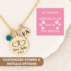 two personalized necklaces are shown with the names of their children and an initial