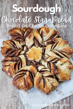 a close up of a pastry on a table with the words sourdough chocolate star bread