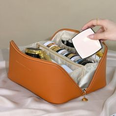 Description: Introducing our high-quality faux leather cosmetic bag, the perfect accessory for staying organized on the go. Made with soft and comfortable faux leather, this bag features a waterproof protective surface to keep your cosmetics safe from getting wet. It is also easy to clean and not prone to collapse, ensuring durability and longevity. With a top handle for easy portability, this toiletry bag can hold all your full-sized cosmetics, makeup tools, toiletries, or travel essentials. Th Square Makeup Bag, Square Makeup, Leather Cosmetic Bag, Travel Bag Organization, Sac Lunch, Beg Tangan, Toiletry Pouch, Travel Storage Bag, Travel Storage