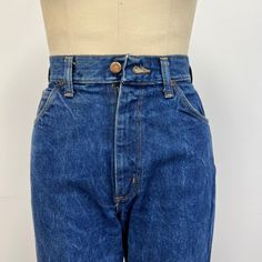 "Vintage 70s high waisted Jantzen jeans featuring; traditional 5 pocket styling a high waist zip fly with single button at the waist straight leg fabric tag with \"Jantzen\" diver logo on the coin pocket, and \"Jantzen\" tab on the back pocket of a heavy, 100% cotton denim in a dark blue wash labeled \"Jantzen Made in USA\" and tagged a size 10, measurements when laid out flat are; 13 1/2 inches at the waist 19 1/2 inches at the hip 13 inch rise 35 1/2 inch inseam in good, preworn, vintage condi Womens Jeans, Fabric Tags, Diver, Vintage 70s, Hand Sewing, Made In Usa, Dark Blue, High Waist, Straight Leg