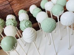 there are many green and white cake pops