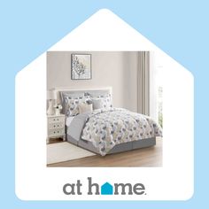 a blue and white bedroom with the words at home on it's front page