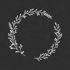 a white wreath on a black background with the word love written in cursive writing