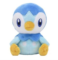 a blue and white stuffed animal with big eyes