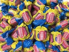 a pile of candy wrapped in blue and yellow wrappers