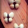 four different pictures of white balls on a wooden surface