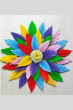 a colorful flower made out of folded paper