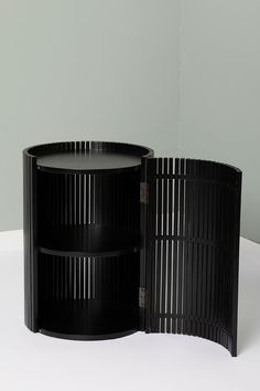 two black round tables sitting next to each other