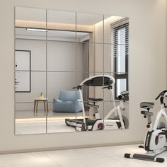 an exercise room with mirrors and treadmills in the foreground, along with a blue chair