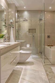 a bathroom with a toilet, sink and bathtub in the middle of the room