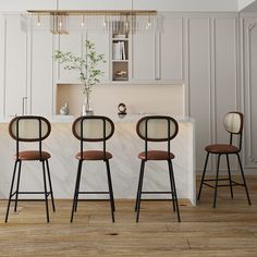 three bar stools in front of a kitchen island