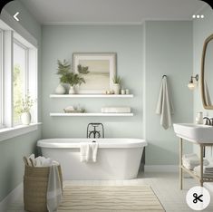 a white bath tub sitting next to a sink under a mirror in a bathroom with green walls