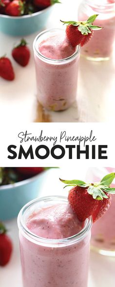 strawberry pineapple smoothie in small glass jars with strawberries on the top and bottom