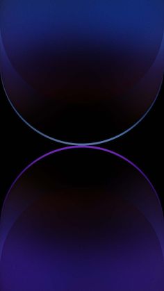 an image of two circles in the middle of a dark blue and black background,