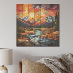 a painting on the wall above a bed in a room with a lamp and pillows