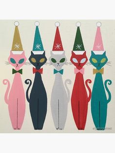 a group of cats wearing christmas hats and bow ties