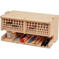 a wooden box filled with lots of craft supplies