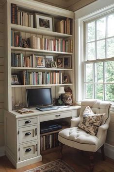 a white chair sitting in front of a desk with a laptop computer on top of it