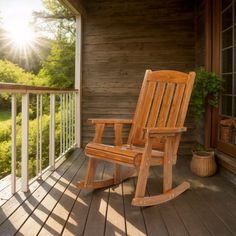 a wooden rocking chair sitting on top of a porch