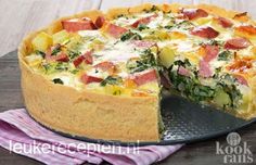 a quiche with ham, cheese and spinach