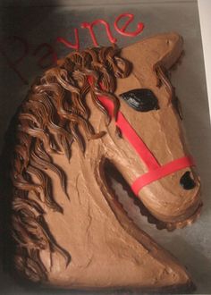 a cake shaped like a horse is on display