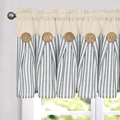 a window curtain with buttons on it