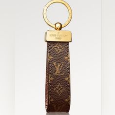 a key chain with a gold ring on it