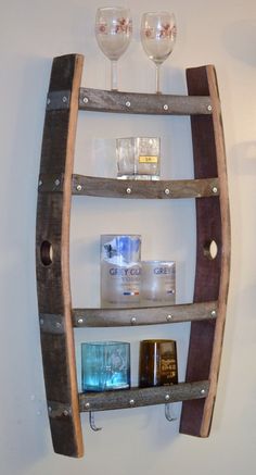 a wooden shelf with wine glasses on it