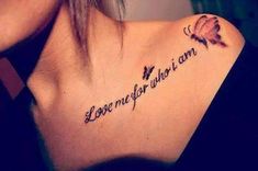 a woman with a tattoo on her shoulder that says love me if you amn