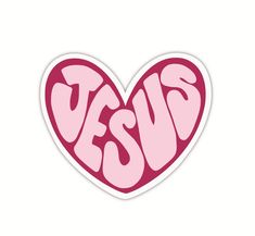 a heart shaped sticker with the word yes in pink and red letters on it