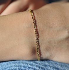 DETAILS: 14K SOLID GOLD - 1.30 GRAM - 2 MM Fast Shipping 🛫 💖 14K Solid Gold Figaro Chain Bracelet, Wear it solo or Layer it with Other Bracelets or Charms. 🎁 Birthday Gift, Dainty Custom Figaro Bracelet, Anniversary Bracelet, Birthday Gift, Christmas Gift, Solid Gold Bracelet, Minimalist Gold Rainbow Tennis Bracelet, Wedding Bracelet, Valentine's Day Gift Chain Weight: 1.30 gr (weight may vary by 5% +/- according to production.) Figaro Chain Thickness : 2 mm Gold Anniversary Bracelet Stamp: 1 Gold Bracelet Men, Anniversary Bracelet, Gold Figaro Chain, Figaro Bracelet, Bracelet Valentines, Solid Gold Bracelet, Bracelet Minimalist, Bracelet Wedding, Gold Anniversary