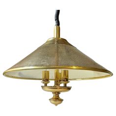 an antique brass ceiling light with mesh shades