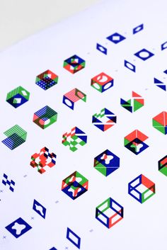 an array of colorful geometric shapes on white paper