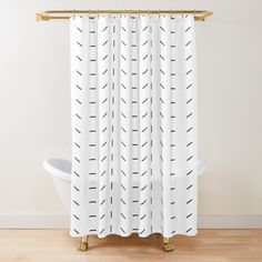 a white shower curtain with black arrows drawn on it in front of a bathtub