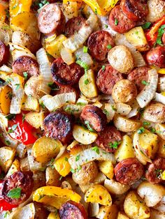 an assortment of sausages, potatoes and peppers