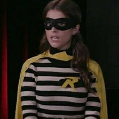 a woman dressed in a batman costume