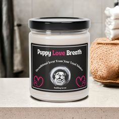 a jar of puppy love breath sits on a counter next to towels and a basket