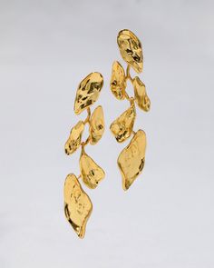 "Find ALEXIS BITTAR Mosaic Molten Post Earrings on Editorialist. Details Rich 14k gold plated metalwork is sculpted to create a cascade of abstract petals on these 1950s modernist inspired post earrings. Designed to allow the delicate petals to swing with movement. 14k gold plated brass, surgical steel ear posts Clear disc earring back UPC: 889519124168 Measurements 2.75\" length x .75\" width Care To clean your molten gold leaf drop earrings, gently wipe the surface with a soft cloth. For additional care instructions visit our FAQ page. FAQs What are the materials that make up these molten gold leaf drop earrings? The materials that are used in these molten gold leaf drop earrings are signature materials of the Alexis Bittar jewelry collection. Combinations of crystals and custom metalwor Molten Gold, Kids Stationary, Alexis Bittar Jewelry, Abstract Jewelry, Let It Flow, Pearl And Diamond Ring, Modernist Jewelry, Stacked Bangles, Disc Earrings