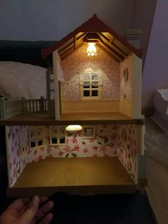 the doll house is lit up and ready to be opened for someone's birthday