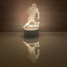 a lamp that is shaped to look like a football player with the number 8 on it