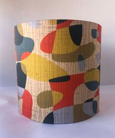 a lampshade with an abstract design on it