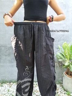 "The harem style trousers made from cotton fabric 100%with an elasticated smock waist and ankles they provide a comfortable lightweight fit, perfect for casual wear, festivals, yoga, holidays as well as pairing with a plain top to get that popular look. Materials: Cotton Sizing: One size fits most. Size : (inches) ✿Waist : 22-42 inch ( 55-106 cm ) ✿ Hip :up to 49 inch ( 124 cm) ✿ Length 40\" ( 101 cm ) ✿2 sides pockets S I Z E : US SIZE 4 - 12 , UK SIZE 8 - 16 , EU SIZE 36 - 44 MODEL SIZE : size Black Hippie Harem Pants, Hippie Full-length Harem Pants For Festivals, Bohemian Non-stretch Harem Pants, Non-stretch Bohemian Harem Pants, Black Full-length Bohemian Harem Pants, Green Pants Men, Bohemian Pants, Hippie Clothing, Style Trousers