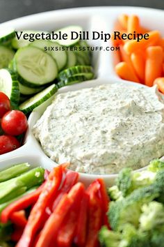 a plate filled with dip surrounded by veggies