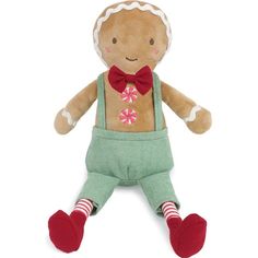 a small stuffed ginger wearing overalls and a bow tie